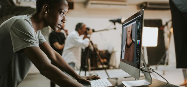Female Creative Director Checking a Headshot on the Monitor